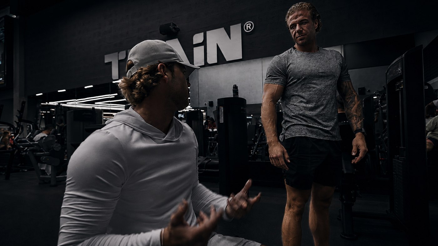 Leroy talking a client through the plan in the gym